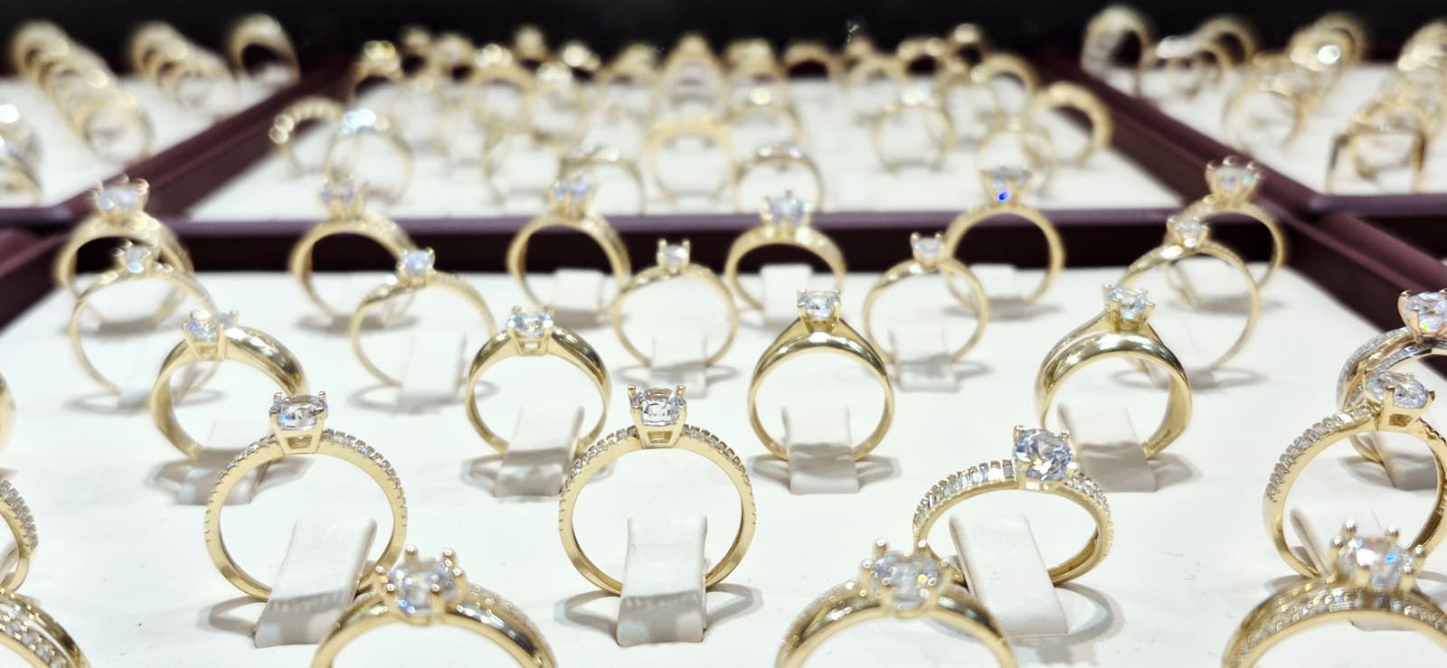 Best gold prices in Hull: Close-up of our professional ring display showcasing a wide variety of elegant gold bands and stones.