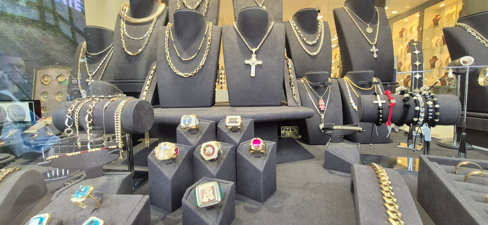 Best gold prices in Hull: Stunning window display featuring high-quality 9ct and 14ct gold necklaces and rings.